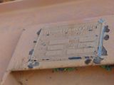 a rusted sign on the side of a rusted truck