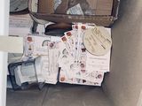 a cardboard box with many items inside of it