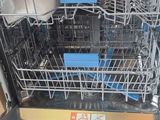 a dishwasher with a lot of dishes inside of it