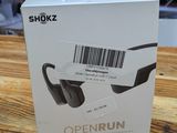an open box of a pair of sunglasses sitting on top of a wooden table