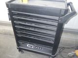 a black tool cabinet with a lot of drawers on it