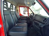 a red truck with black seats in the back of it