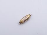 a gold plated metal bead with blue and white stones