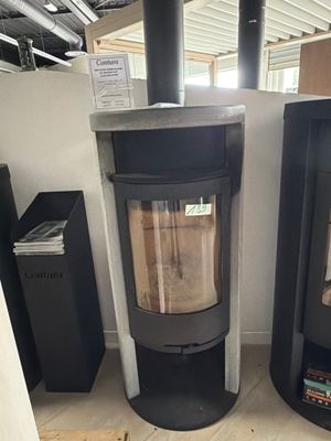 two wood burning stoves in the corner of a room
