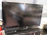 a flat screen tv sitting on top of a dresser