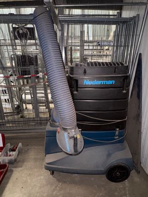 a machine that is on a cart in a garage