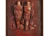 an image of a wooden sculpture of two women and a child