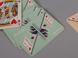 two playing cards that are sitting on a table