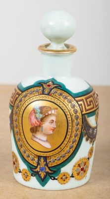 a small bottle with a picture of a woman on it