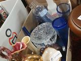 a box full of glass items sitting on a table