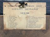 a sign on the door of a building that says henry gerard venise