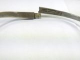 a close up of a knife on a white surface on a table