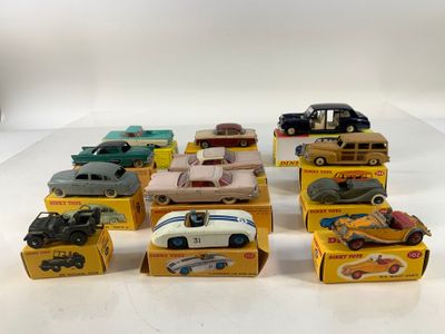 several toy cars are lined up in a row on a white surface