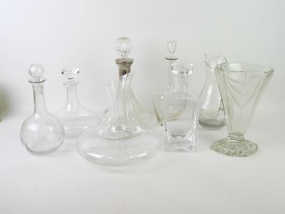 a lot of glass vases on a white table
