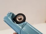 a blue toy car that is being held up by a person