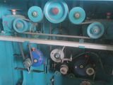 a blue machine that is sitting on a shelf