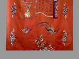 an image of a red cloth with a design of birds and flowers on it