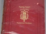 a red book with a gold seal on it