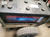 an image of a car battery on a cart