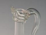 a clear glass vase with a flower inside of it