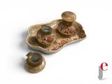 a small tray with a candle holder and a candle holder on it