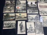 many old postcards that are on display on the table