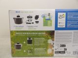a box with the contents of a coffee maker in it