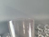a person holding a glass of wine in their hand