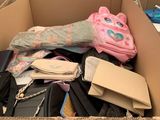 a cardboard box filled with assorted items in a room