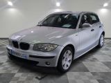 a picture of a silver car parked in a garage