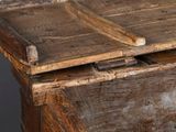 a close up of a wooden table with a drawer on it