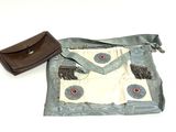 a purse and a wallet sitting on a table