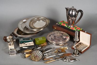 a lot of silverware and silverware on a table