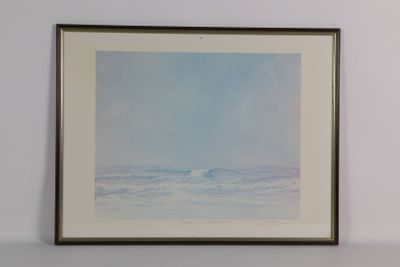 tableau encadré représentant un océan bleu avec une vague qui déferle