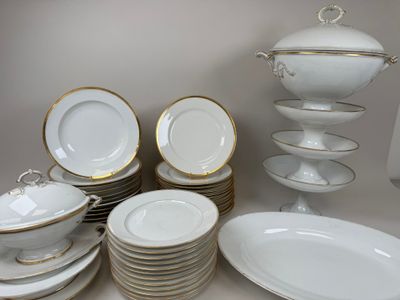 a lot of plates and bowls on the table