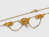 a pair of gold and pearl necklaces