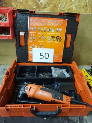 an orange tool box with tools in it sitting on a table