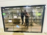 two people standing in front of a store window