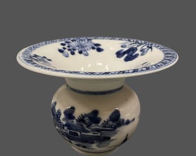 a blue and white vase with a blue and white design on it