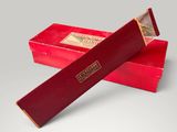a pair of red cigars sitting on top of each other