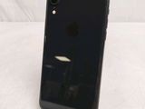 an iphone is sitting on a stand on a white surface