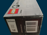 a box of legos sitting on a blue surface