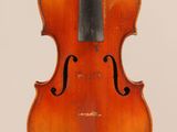 an old violin with a bow hanging from it ' s back