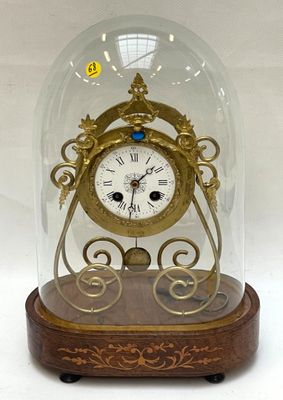 a glass dome with a clock inside of it