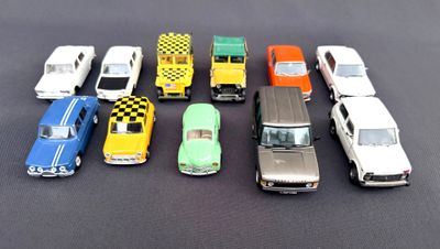 several toy cars are lined up in a row on a black surface