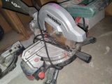 a circular saw on the floor next to other tools