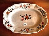 a plate with a floral design on it on a table