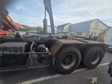 a picture of a truck with a crane on the back of it