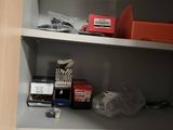 a cabinet with a lot of items on it