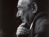 an old black and white photo of a man with his chin resting on his hand